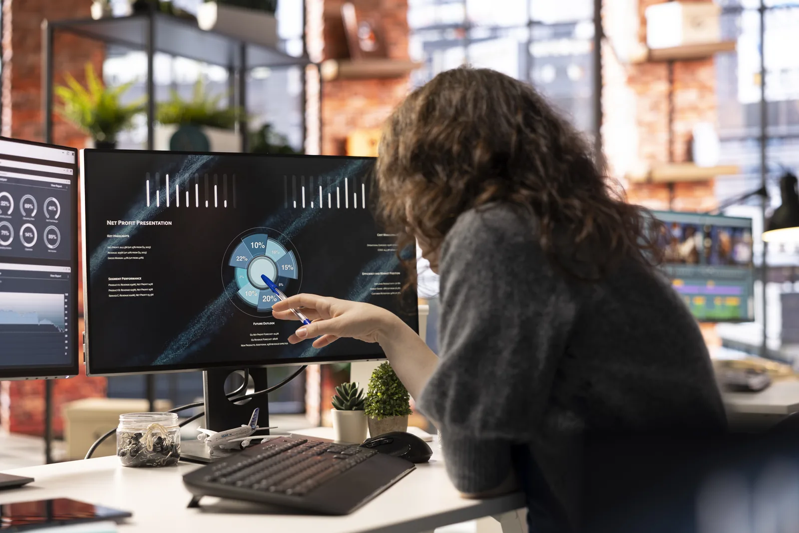 Business analyst reviewing AI cost analytics dashboards