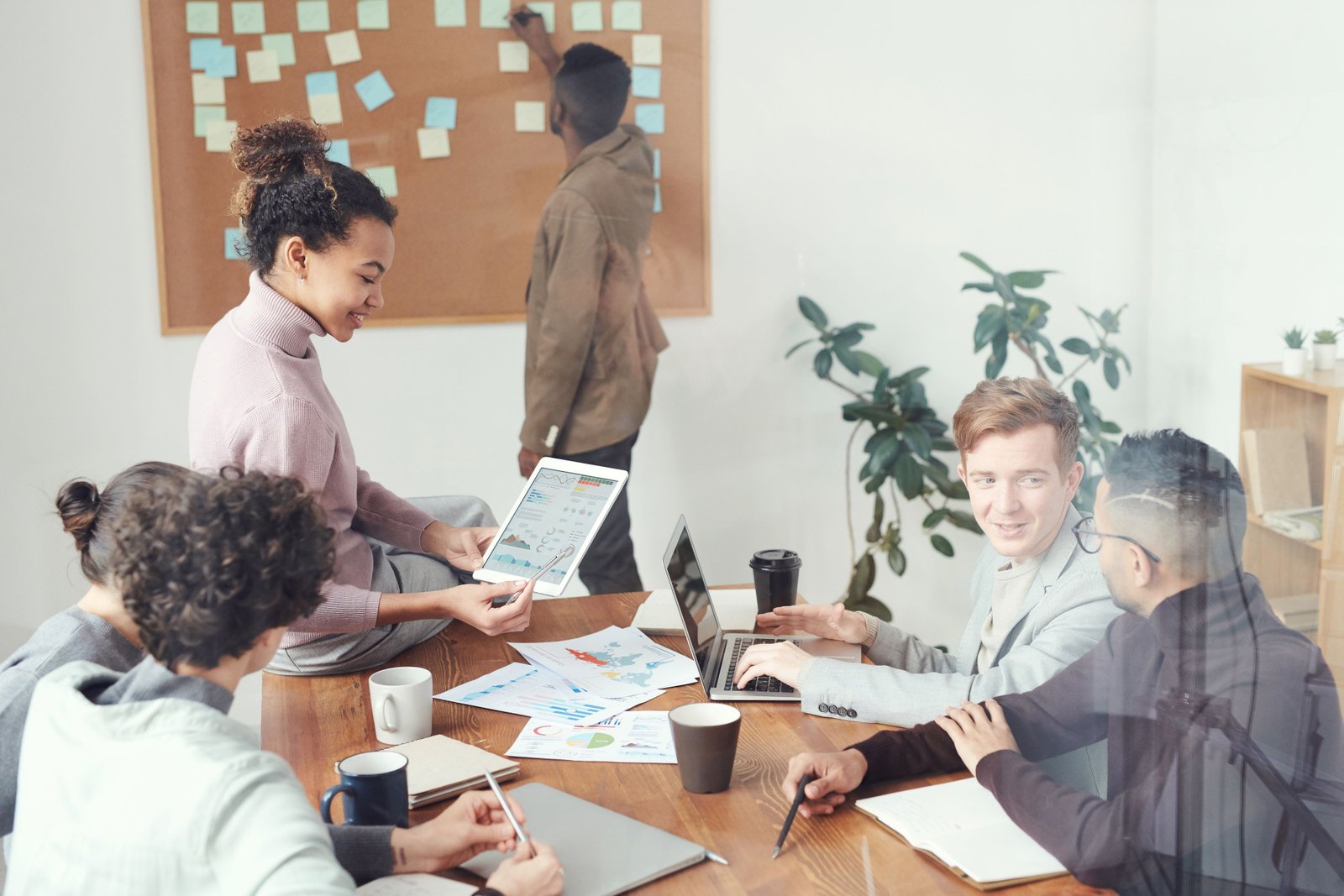 Creative operations team working together around a shared workspace