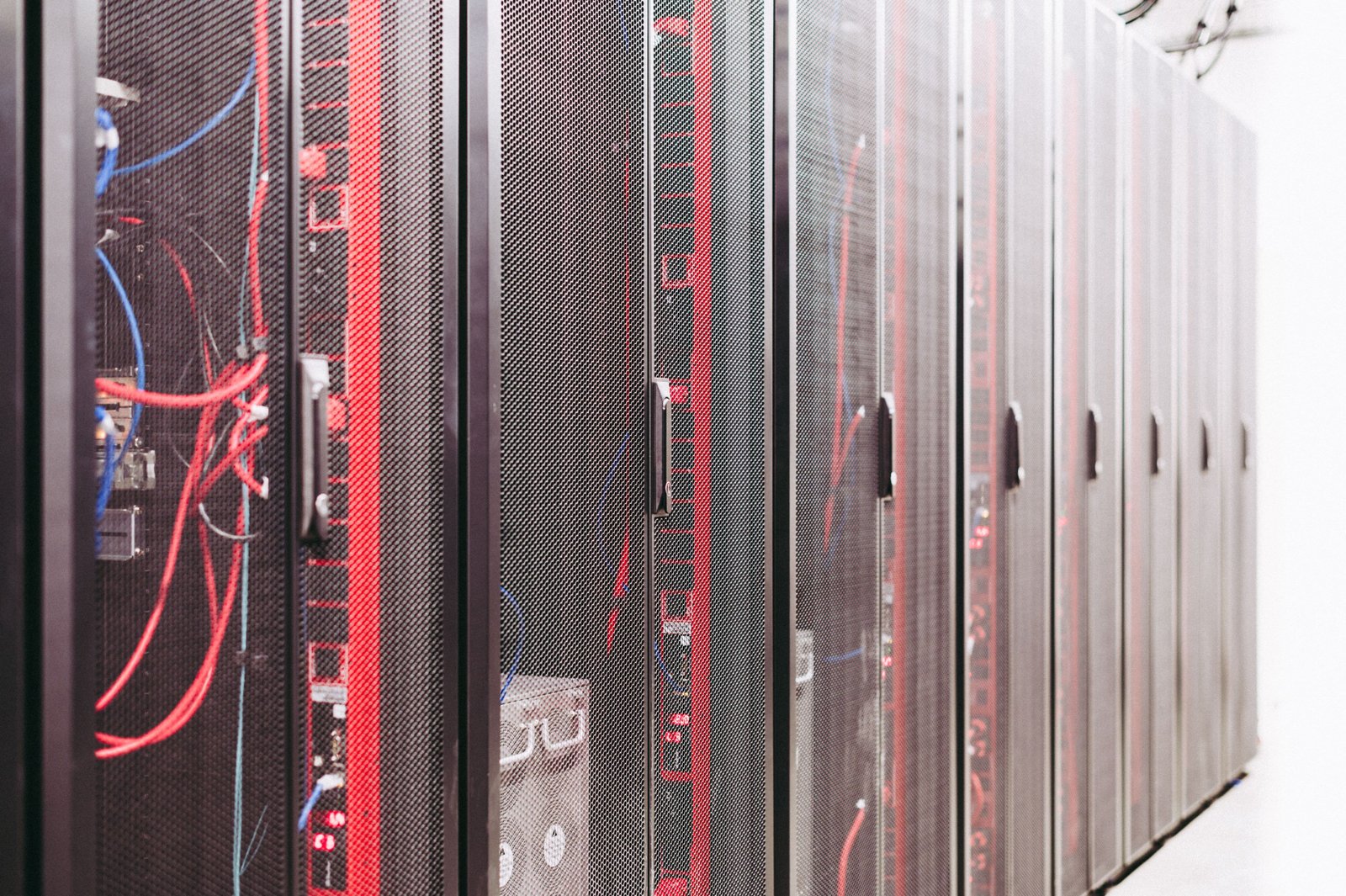 Data center corridor lined with server racks