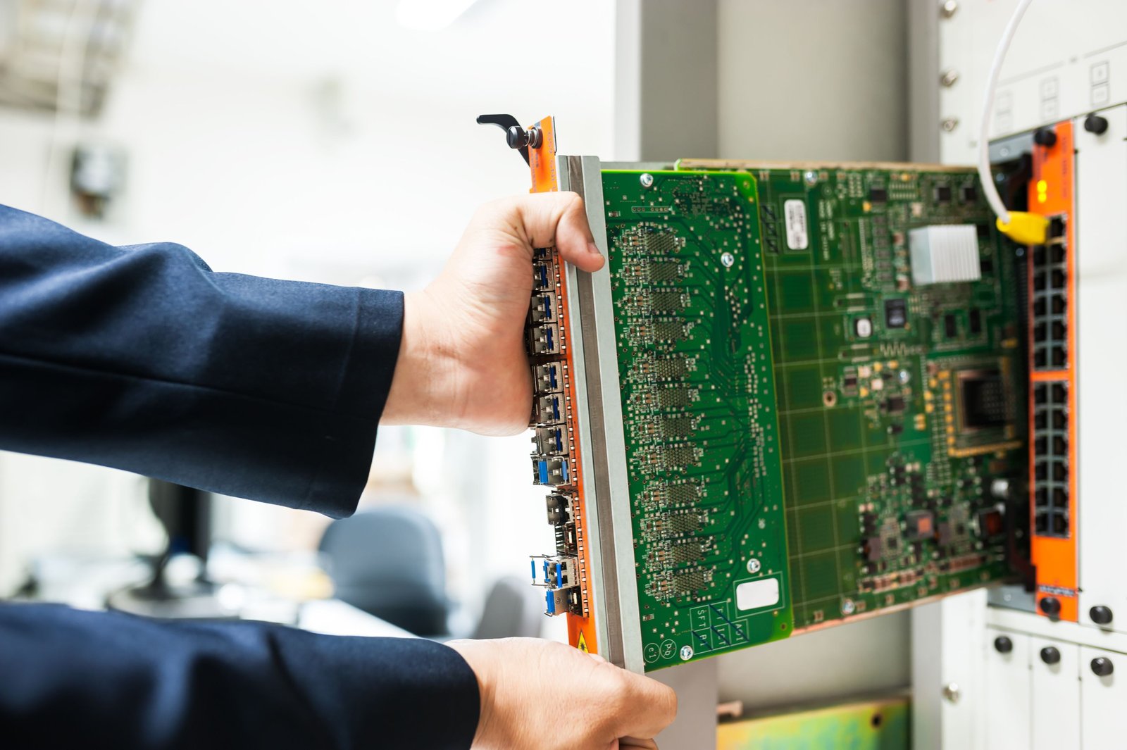 Engineer installing hardware inside a server rack