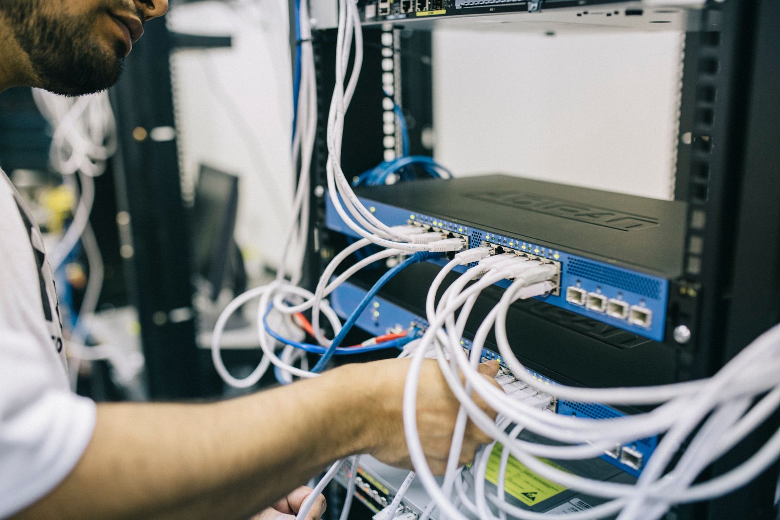 Engineer maintaining network hardware in a data center
