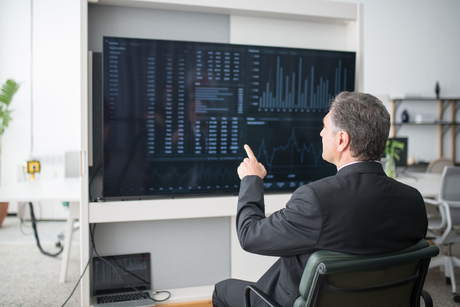Engineers reviewing an automation pipeline dashboard on large monitors