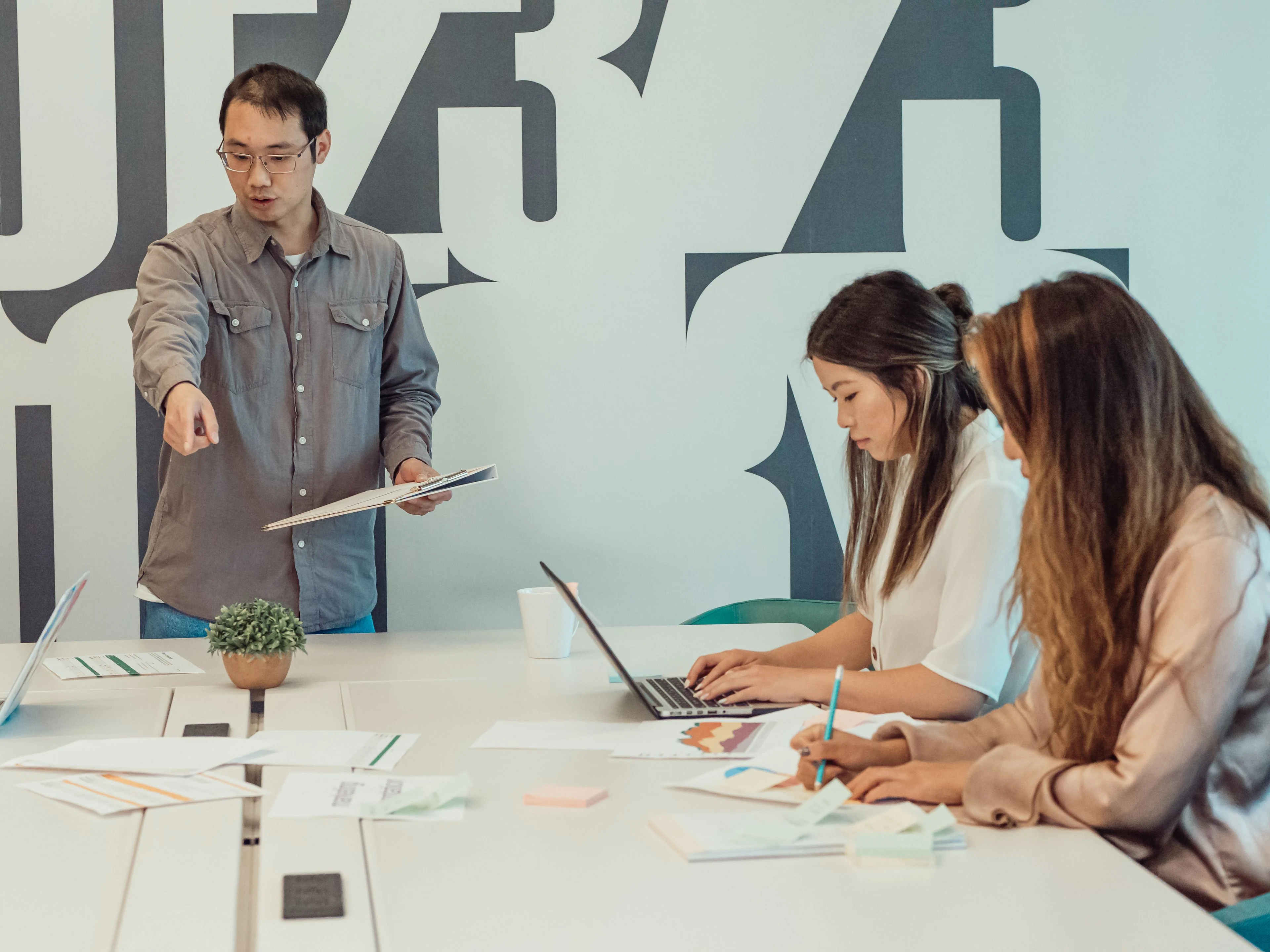 Engineering team in a standup briefing in a modern office