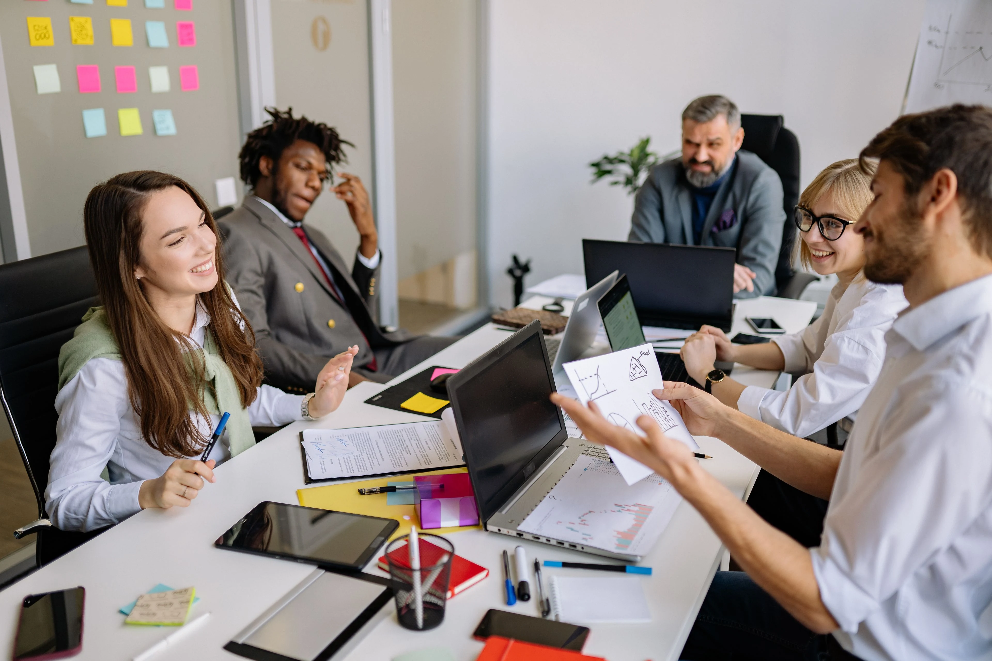 Marketing team in a meeting reviewing charts and content plans